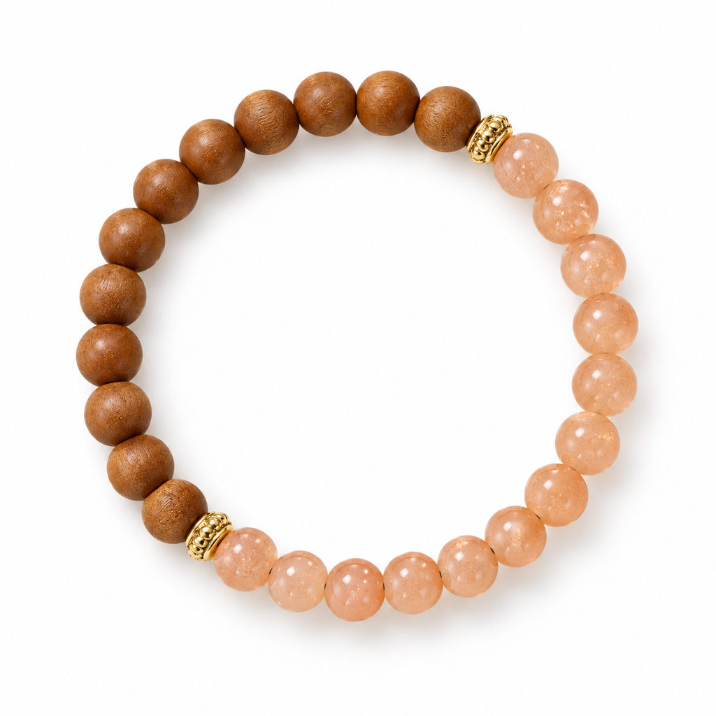 Peach sunstone and sandalwood bead bracelet with gold lantern spacers, on white