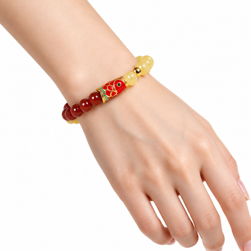 Koi charm beeswax amber and red agate bracelet worn on the wrist