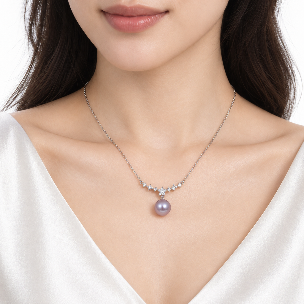 Model wearing the lavender pearl pendant necklace with a white V-neck top