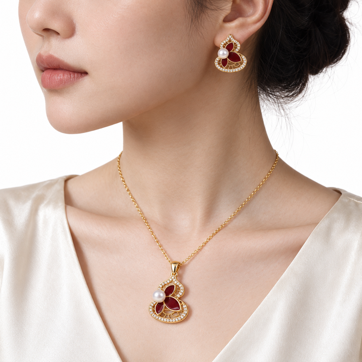 Model wearing the gold lotus pearl pendant necklace and matching earrings