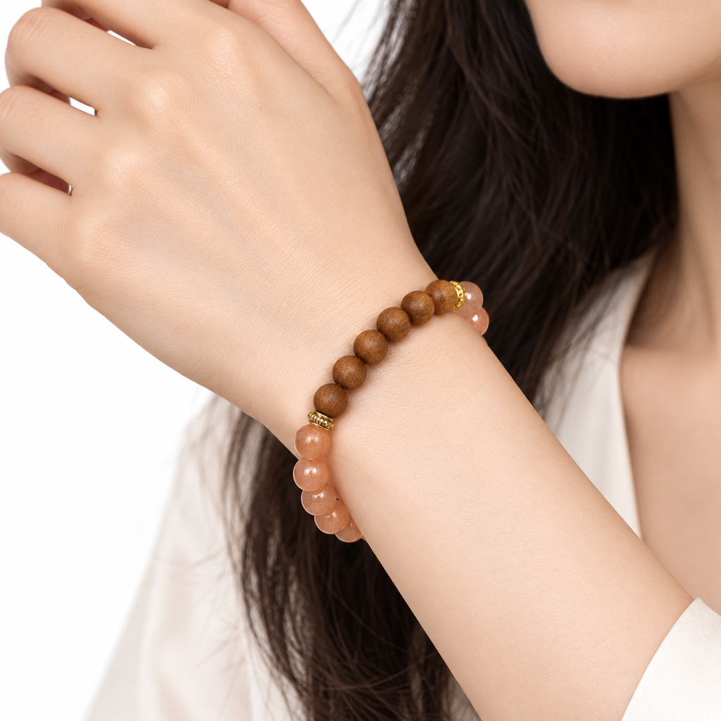 Sunstone and sandalwood bracelet worn on the wrist