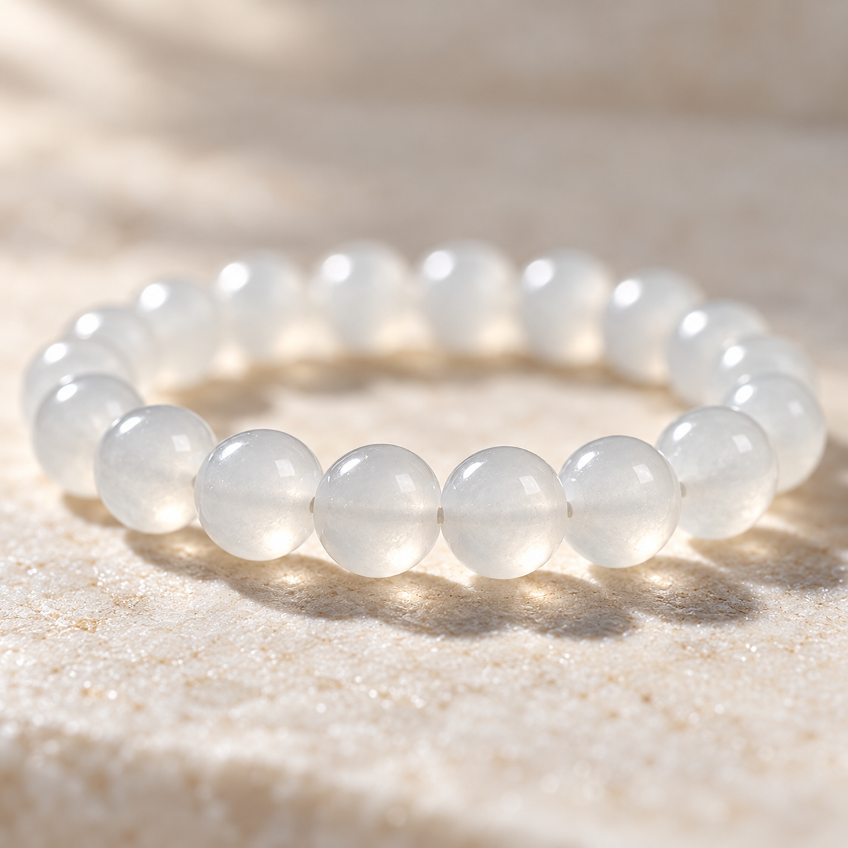 Macro detail of the white nephrite jade beads showing their soft translucence