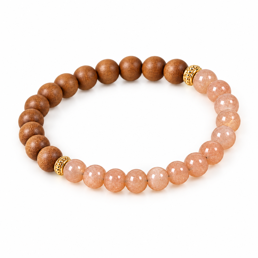 Sunstone and sandalwood bracelet laid out to show the stone and wood halves